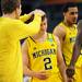 Michigan freshman Spike Albrecht is greeted by senior Matt Vogrich during a time out in the second half at Cowboys Stadium on Sunday, March 31, 2013. Melanie Maxwell I AnnArbor.com